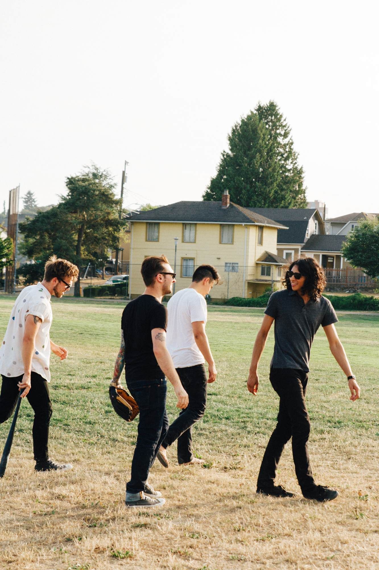 Students walking in a field near Fayetteville