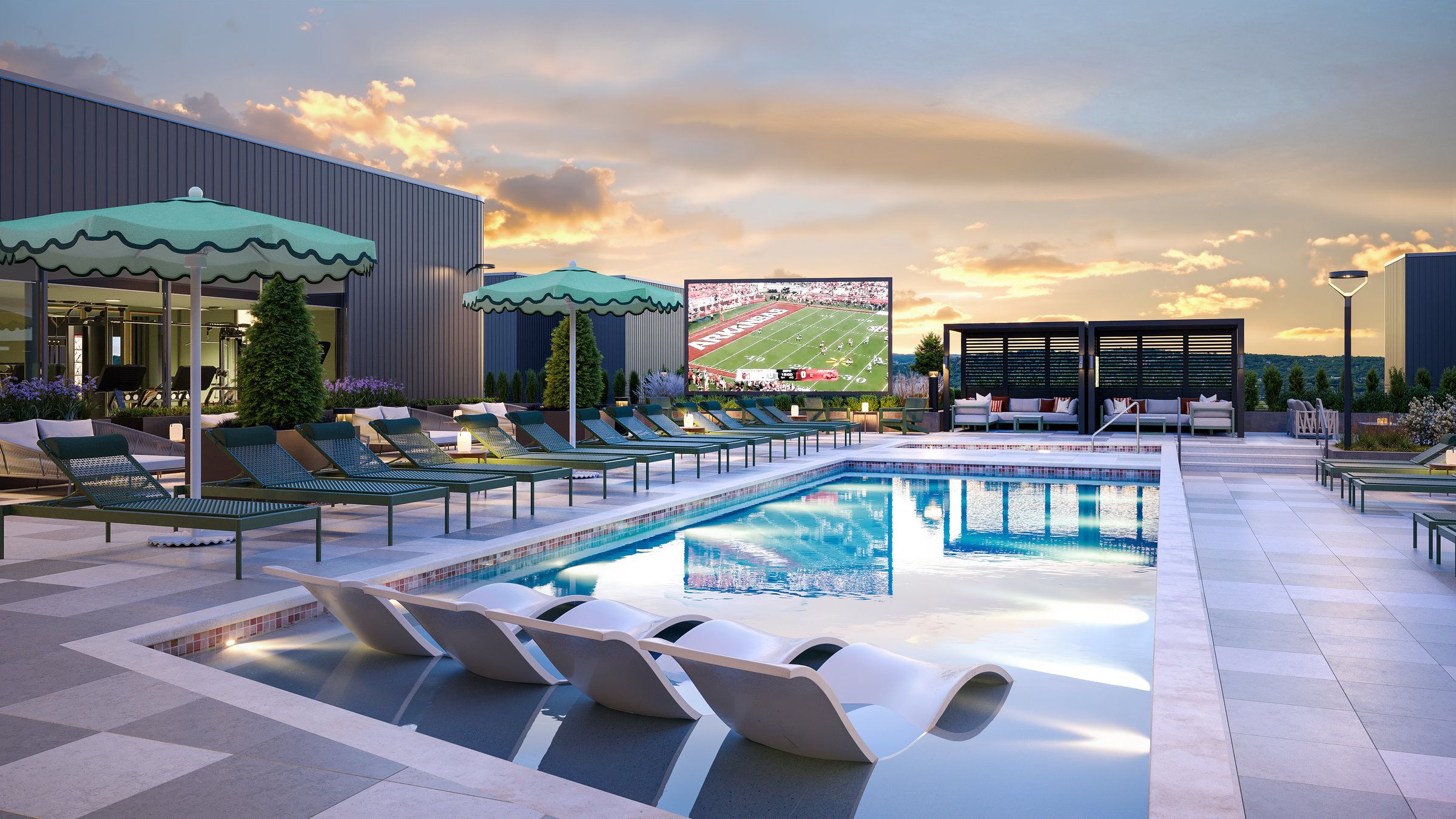 Rooftop pool with lounge chairs, green umbrellas, and a large outdoor screen showing a football game at sunset.