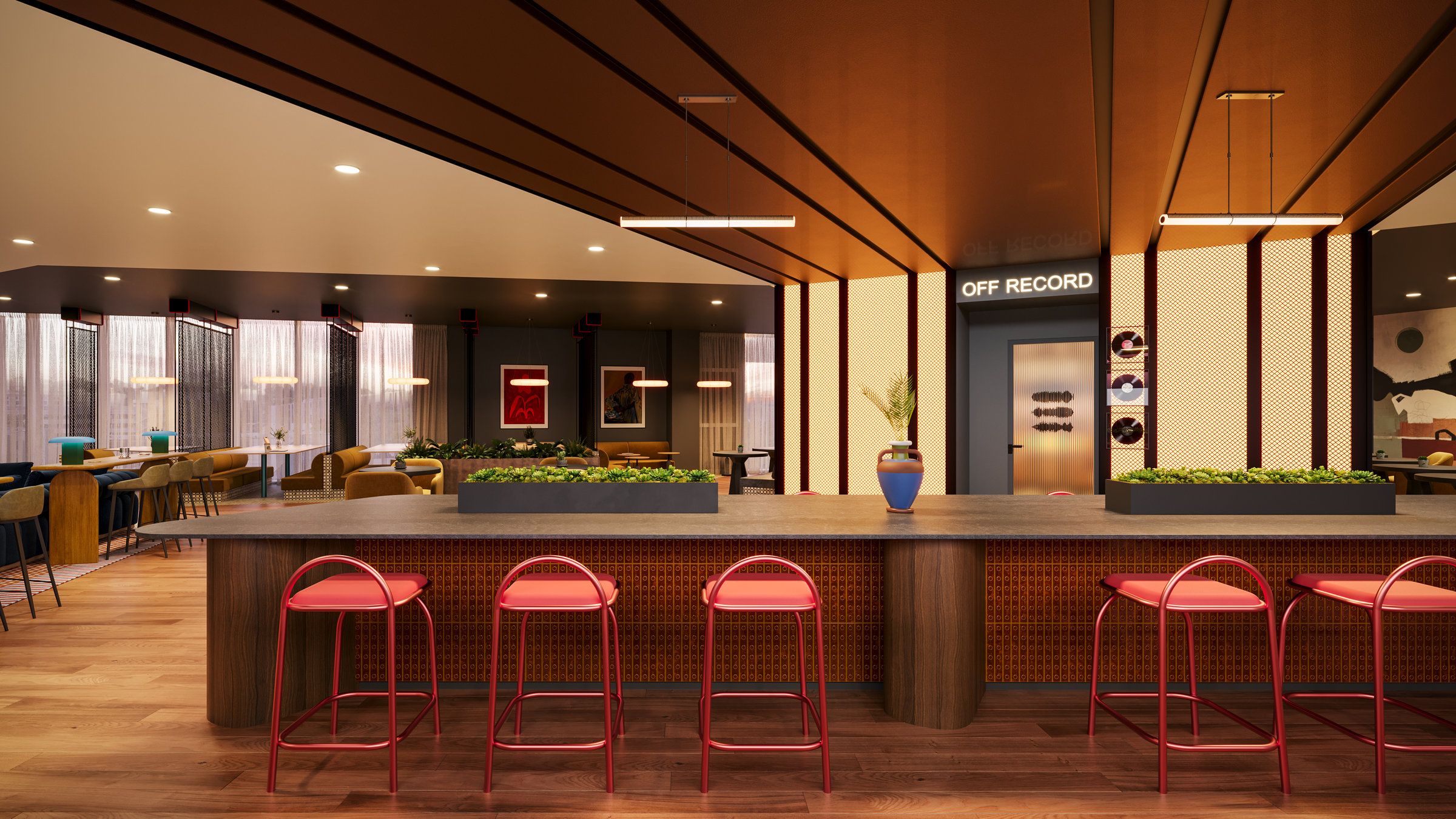 Modern lounge with a long wooden table, red stools, greenery, and a door labeled "Off Record" in the back.