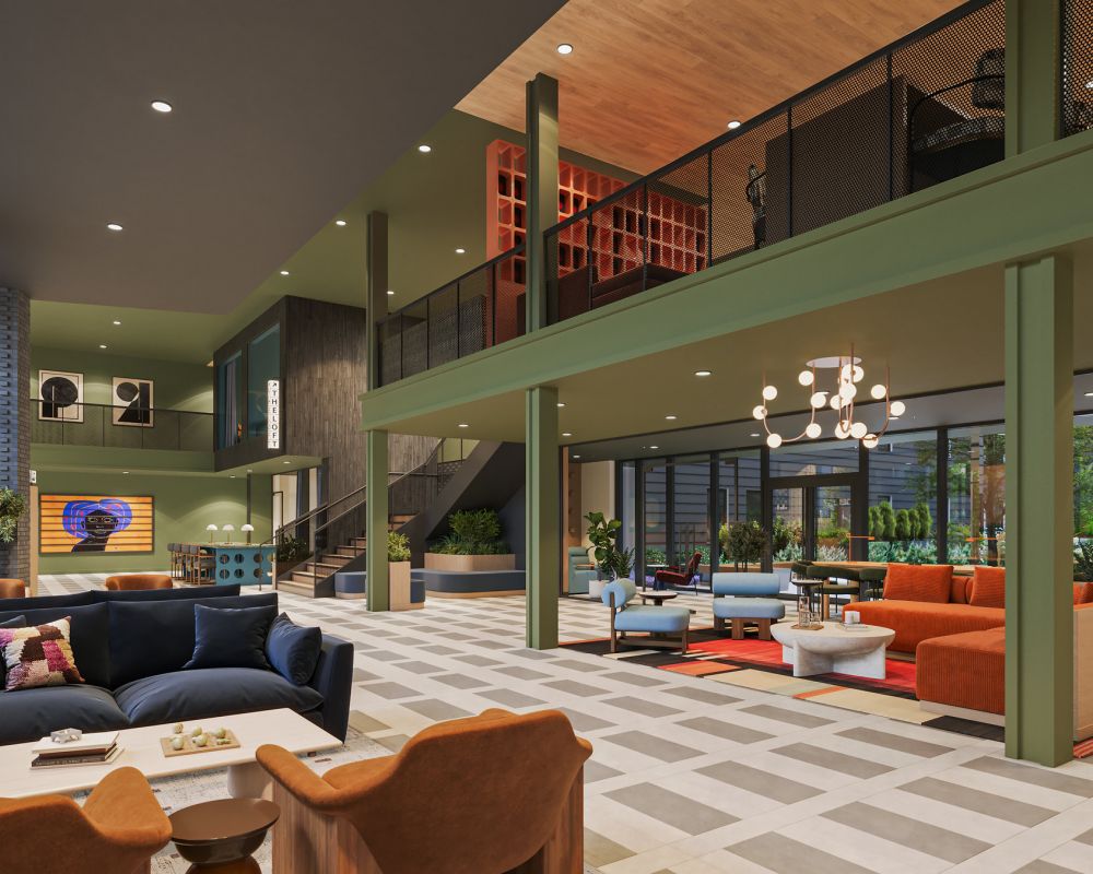 Modern hotel lobby with stylish seating, large windows, and contemporary decor in natural light.