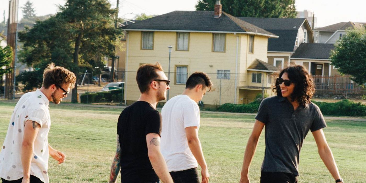 Students walking in a field near Fayetteville